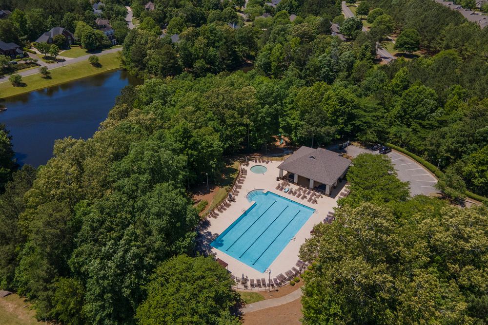 Aerial view of a neighborhood pool and clubhouse in Liberty Park