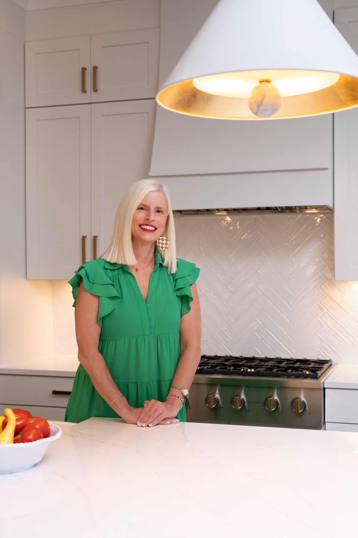 Michelle Creamer smiling in a bright white kitchen